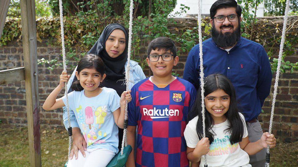 Huda (bottom right) with her siblings and parents