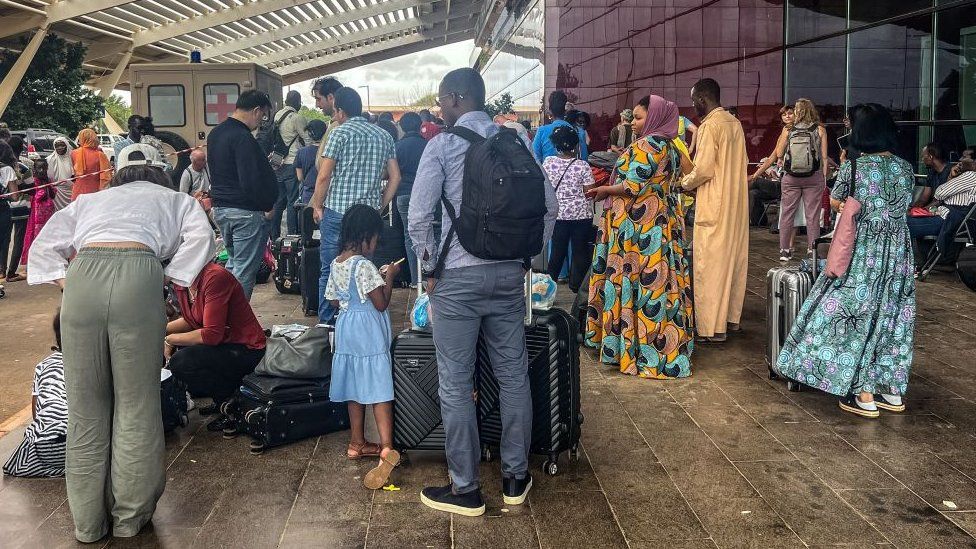 Citizens of European countries are seen outside the Diori Hamani International Airport in Niamey, Niger, on 2 August