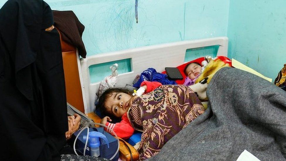 Palestinian children lie on a bed as they receive treatment at Abu Yousef al-Najjar hospital in January