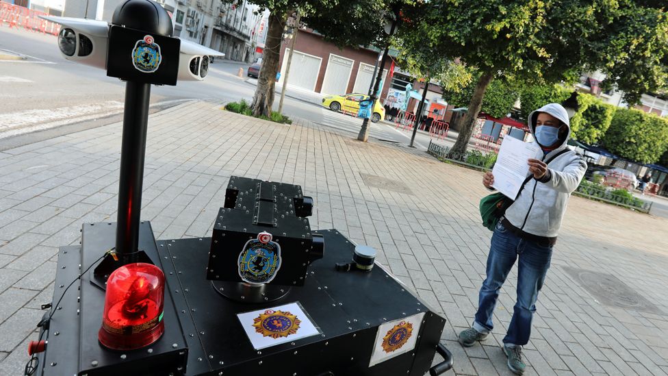 A police robot questions someone in Tunis, Tunisia - 1 April 2020
