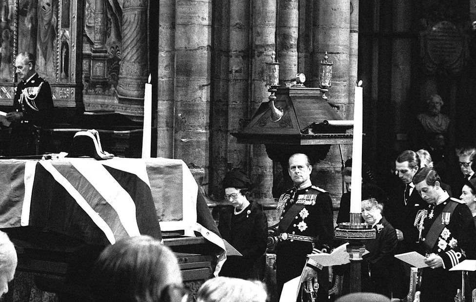 The Union flag-draped coffin of Lord Mountbatten rests on a catafalque during the funeral service in Westminster Abbey. Royal mourners (l/r) Queen Elizabeth II, her husband The Duke of Edinburgh, Queen Elizabeth The Queen Mother and the Prince of Wales, 5 September 1979