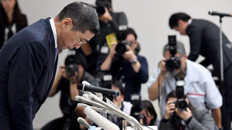 Nissan's Chief Executive Hiroto Saikawa bows in apology