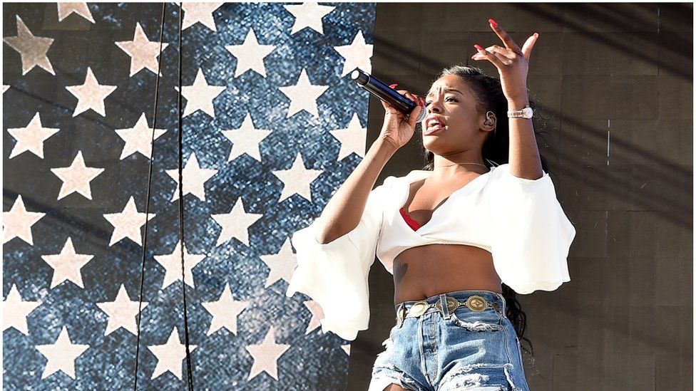 This is a photo of Azealia Banks performing at a music festival in America.