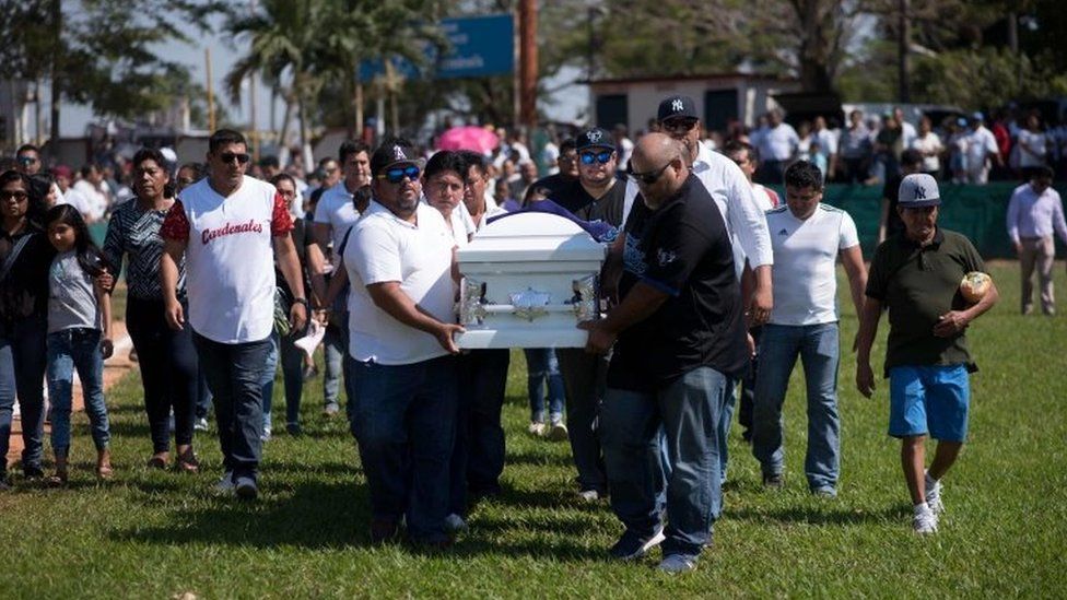 Relatives and friends of a victim of an attack carry a coffin at a funeral in Minatitlan, Veracruz State, Mexico, on April 21, 2019