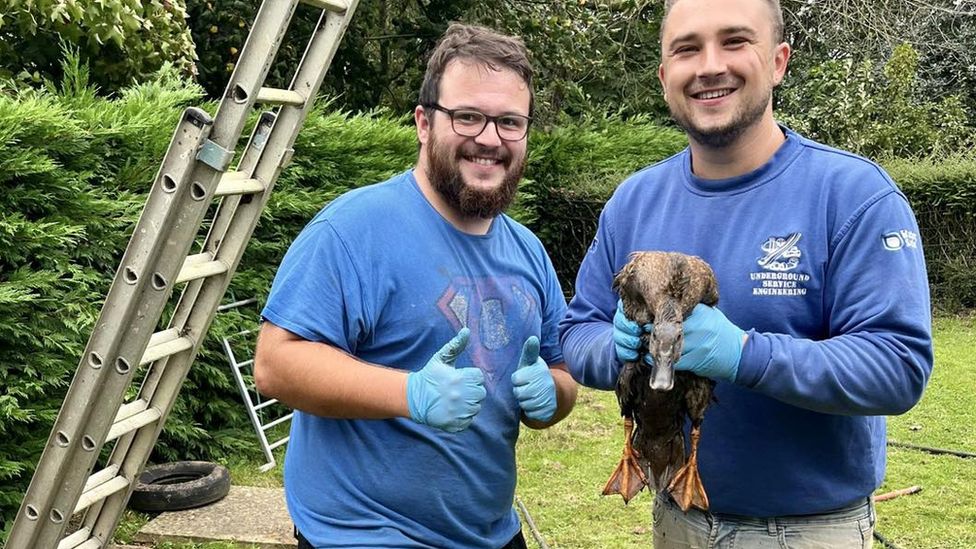 both rescuers with the duck