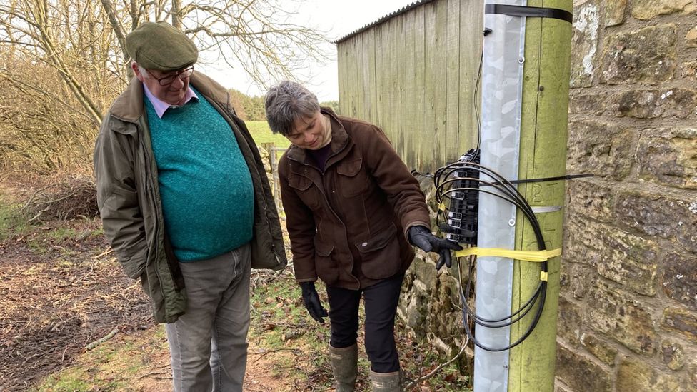 Victoria Knox and Christopher Hewitt inspected patched up broadband cables on a telegraph pole near their home