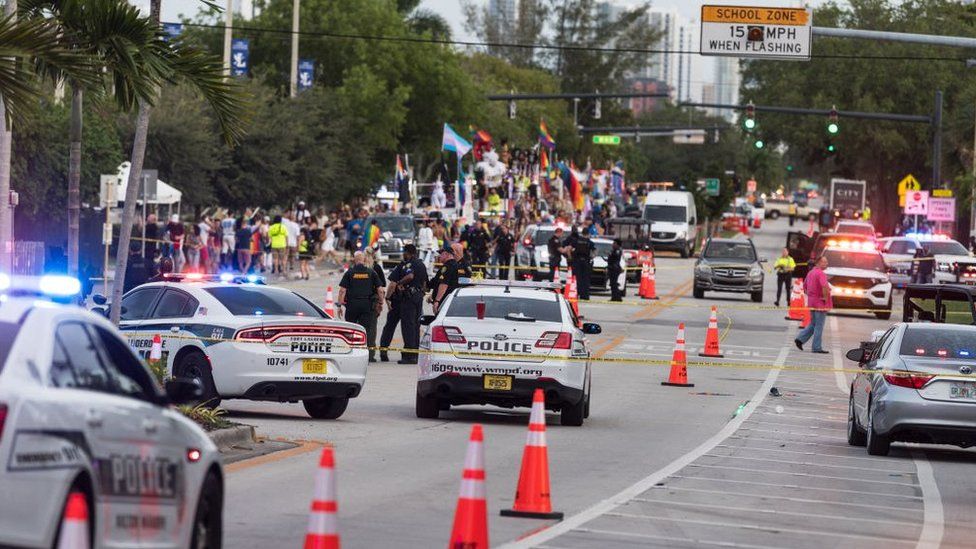Police at the scene after a car drove into a Pride parade in Florida, June 2021