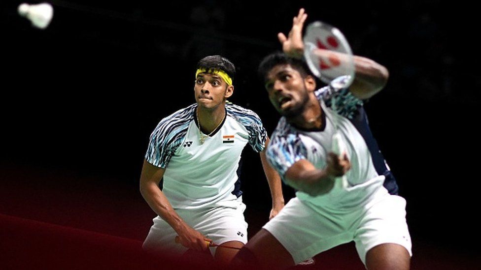 India's Satwiksairaj Rankireddy (R) and Chirag Shetty (L) compete against Indonesia's Mohammad Ahsan and Kevin Sanjaya Sukamuljo during the men's finals of the Thomas and Uber Cup badminton tournament in Bangkok on May 15, 2022