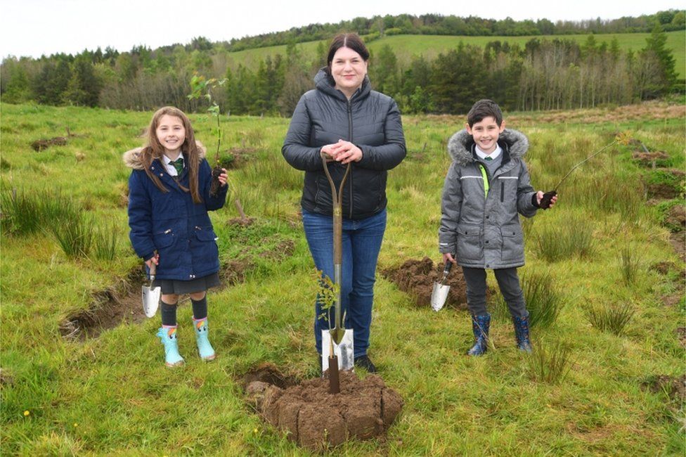 Susan Aitken tree planting with children