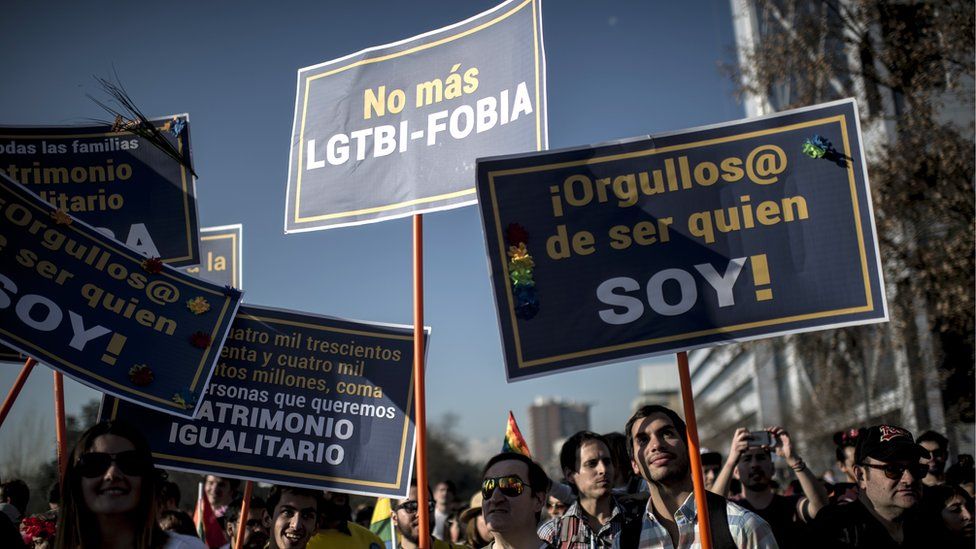 Activists take part in the Gay Pride Parade in Santiago on July 1, 2017.