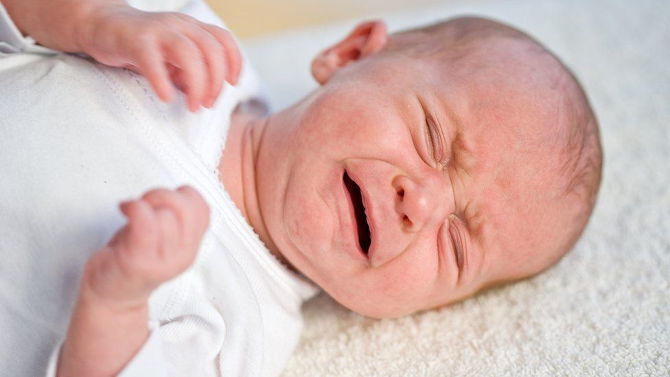 A baby with colic who is crying excessively