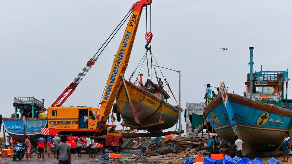 Mumbai fishing boats being cleared ahead of the cyclone