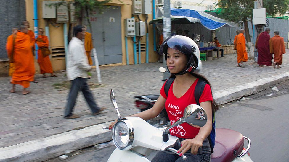 Phnom Penh's No 1 ladies taxi scooter agency - BBC News