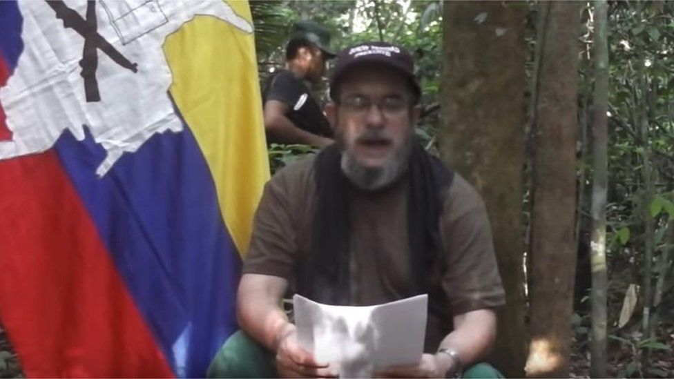 Rebel leader Timochenko reads a message in a video recording