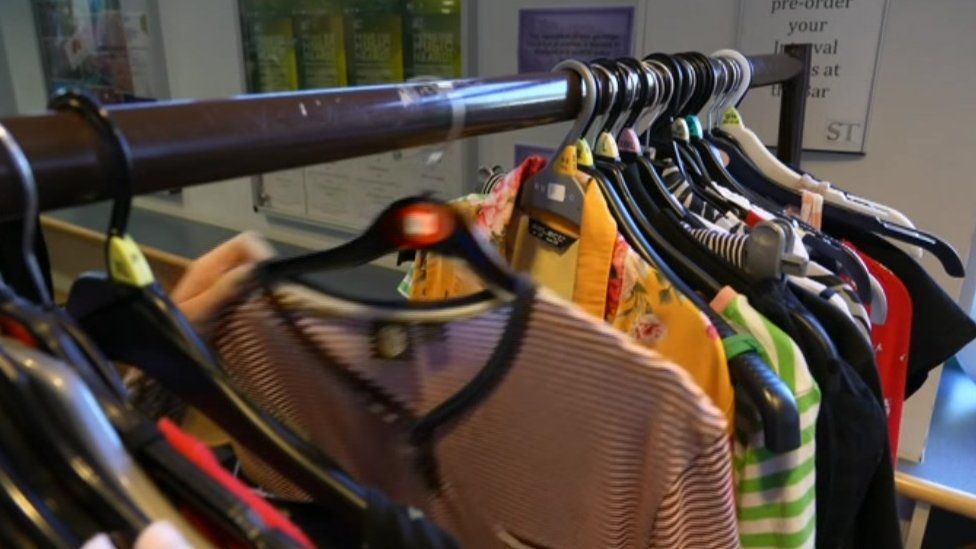 Tops on a clothing rail