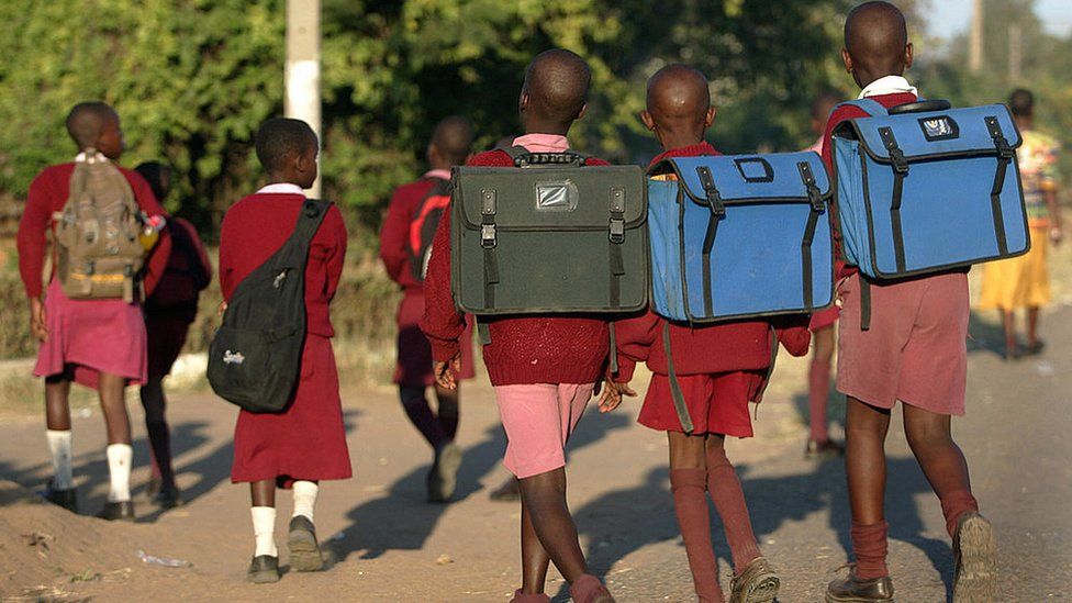 Zimbabwean students go to school on May 7, 2008 in Mbarae, Harare