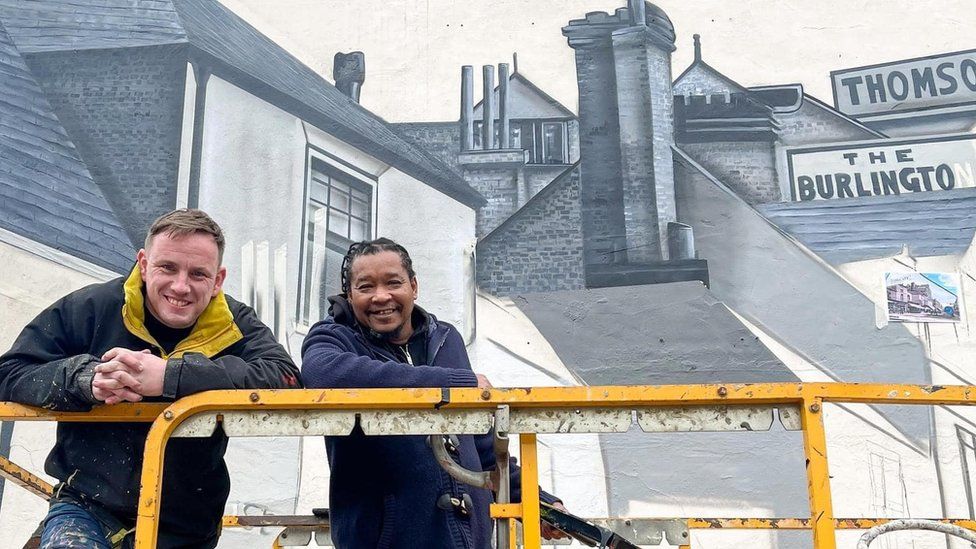 Nathan Murdock and Tony Nero in front their mural