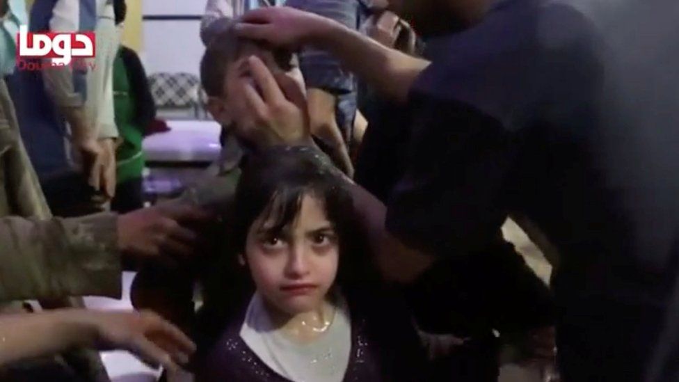 Children being treated by medics following suspected chemical weapons attack in what is said to be Douma