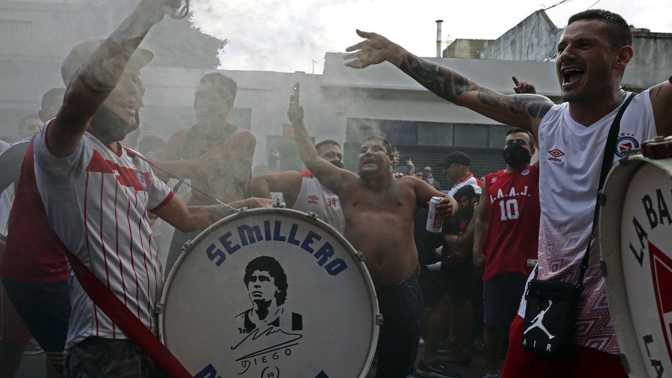 Fans of Argentinos Juniors' football team, where Argentinian football legend Diego Maradona used to play gather outside the stadium