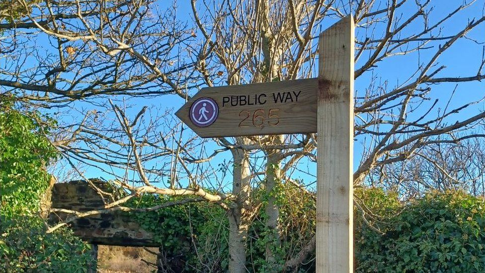 A new wooden sign that has been installed as part of the works