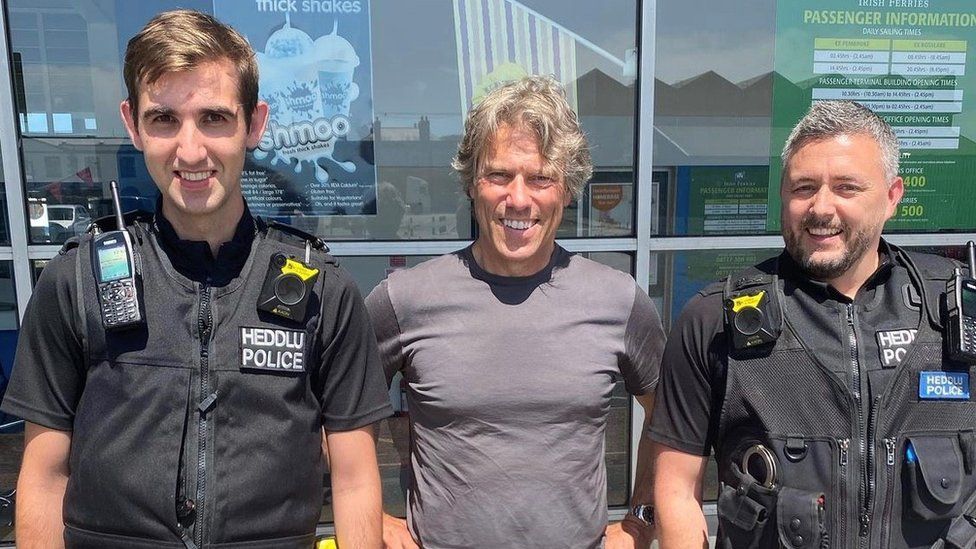 John Bishop and police officers