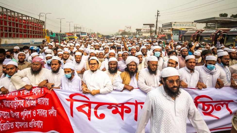 Activists of the Hefazat-e Islam, walk along a road during a demonstration in Dhaka on March 27, 2021.