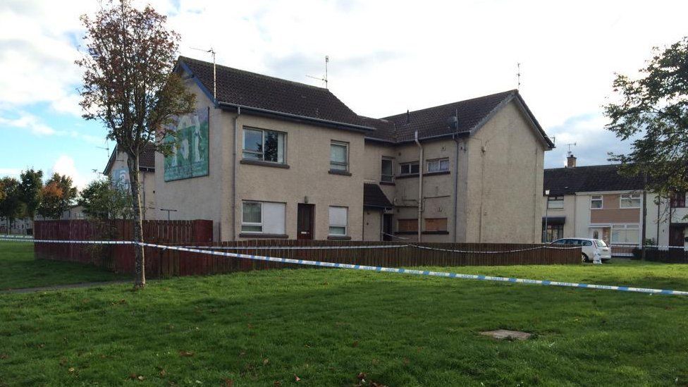 Police have cordoned off the flat in Dingwell Park where the man's body was discovered