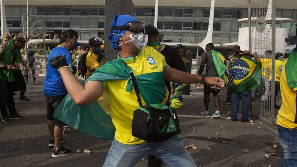 Supporters of former President Jair Bolsonaro clash with security forces as they raid the National Congress in Brasilia