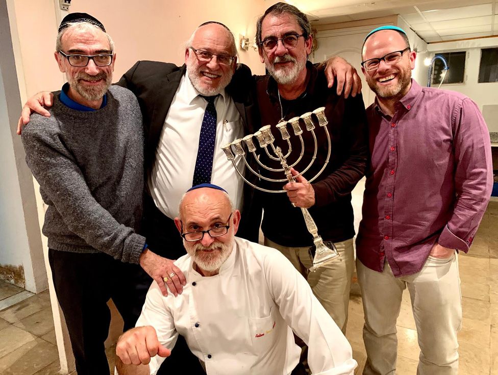 Dani, right, and Toni (in chef's jacket) with other members of the Jewish community