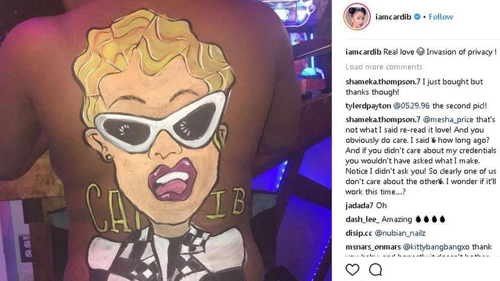 Cardi B's face painted on to a fan's back