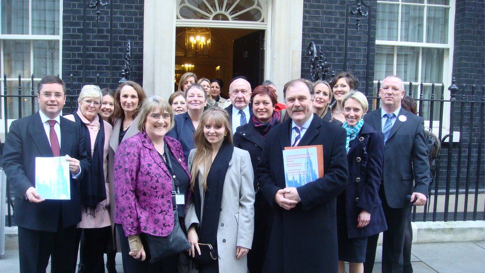Members of the inquiry that led to the introduction of specific stalking laws pictured outside Downing Street in March 2012 as the legislation is announced