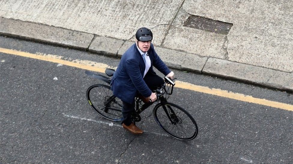 Boris Johnson on a bicycle