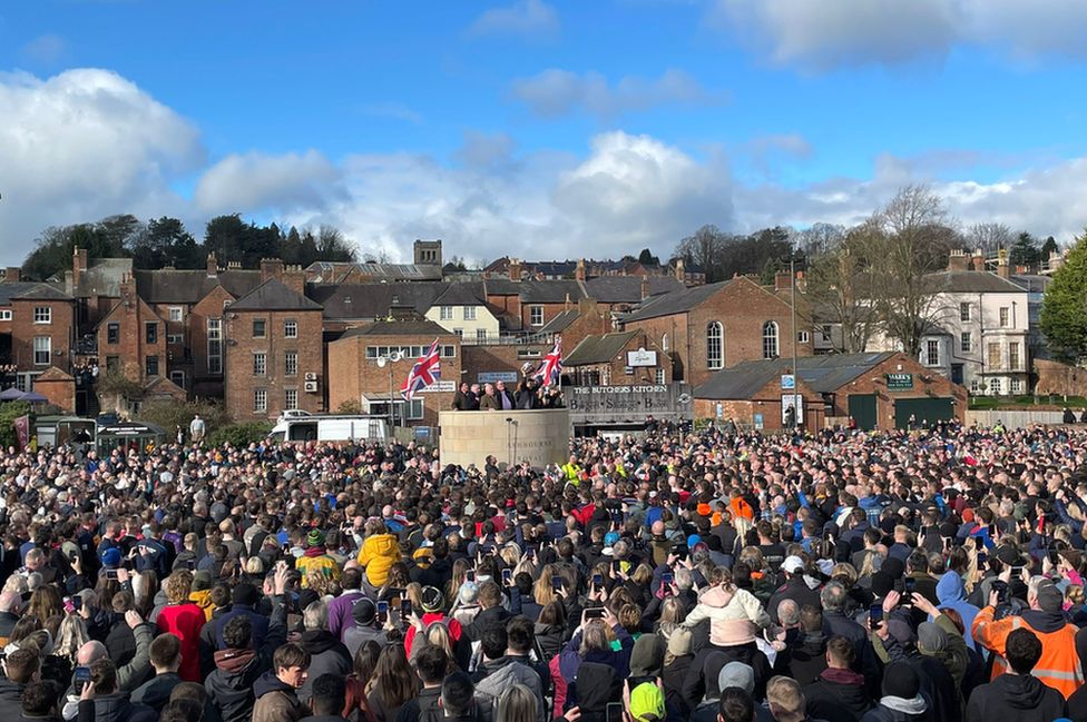 Ball being turned up from the new Royal Shrovetide Football plinth in Ashbourne 2023