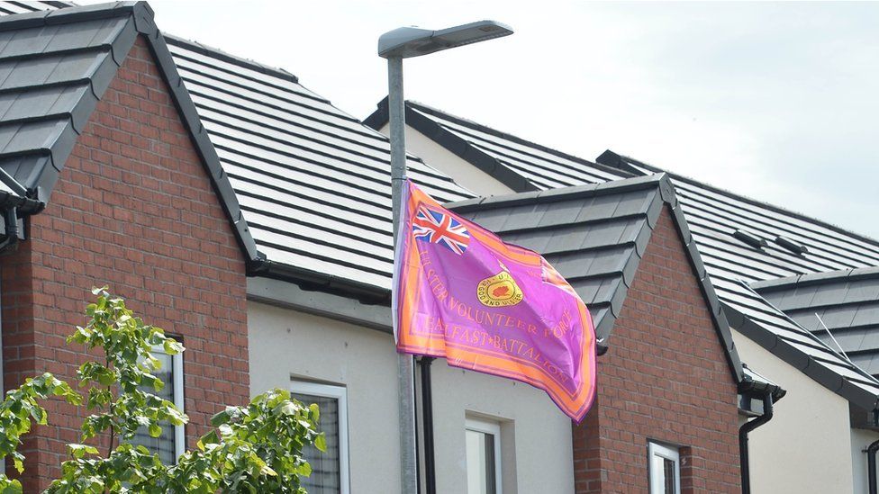 An Ulster Volunteer Force flag hanging from a lamp post in Belfast