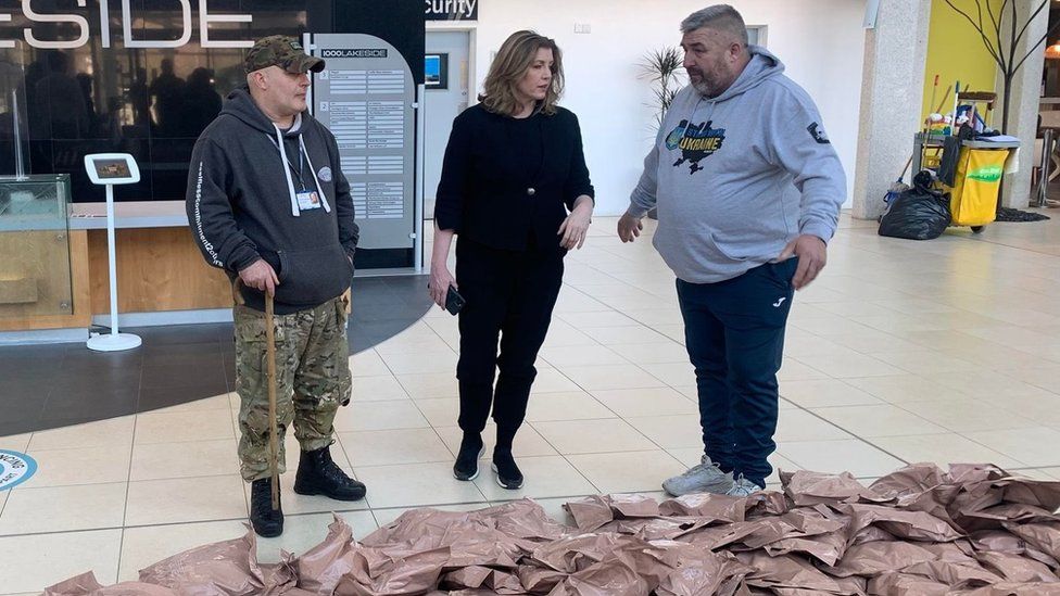 Penny Mordaunt and people from the Forgotten Veterans charity