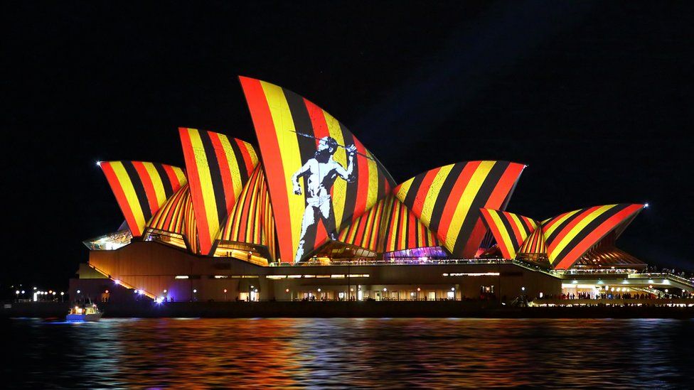 The colours of the Aboriginal flag are projected on to the Sydney Opera House in 2016