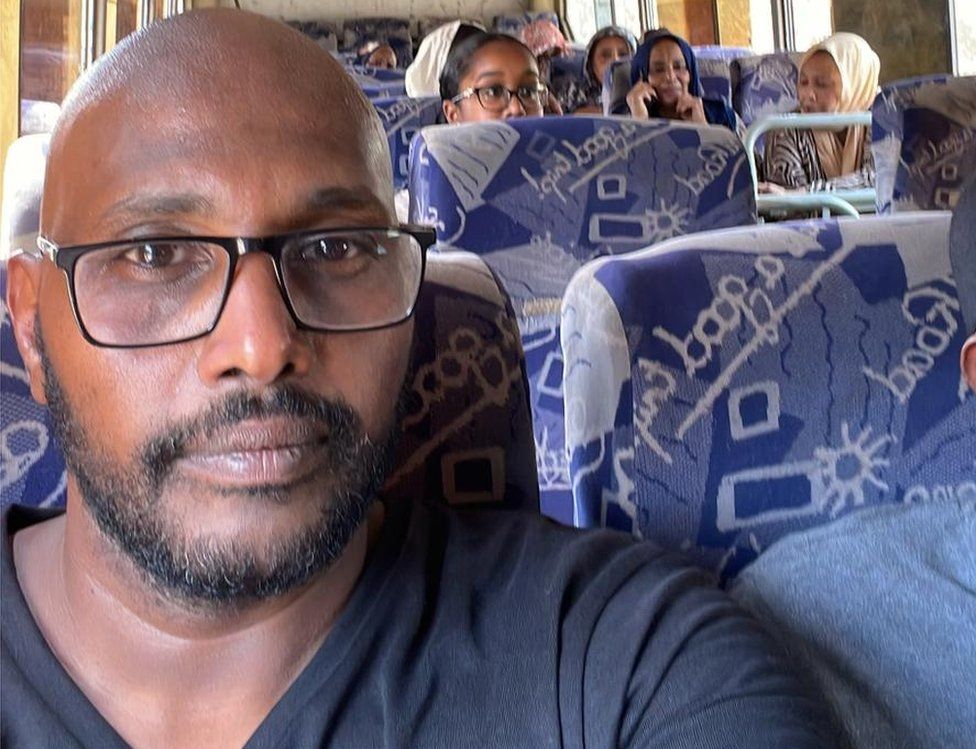 Amar Osman and his family on a bus in Sudan