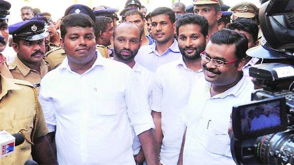 The convicts come out of the court after the verdict in Kochi on Friday.