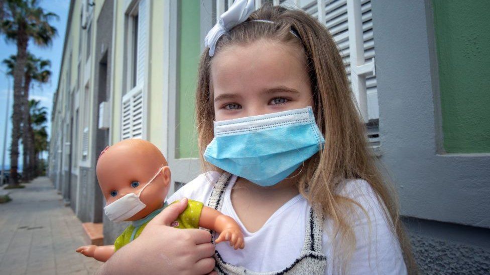 Child wearing a face mask in Tenerife, Spain