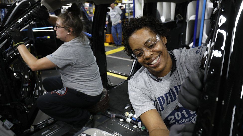 Ford workers Jasmine Powers (right) and Cassie Bell (left), install visors in the all-new 2018 Ford Expedition SUV at the Ford Kentucky Truck Plant October 27, 2017 in Louisville, Kentucky.