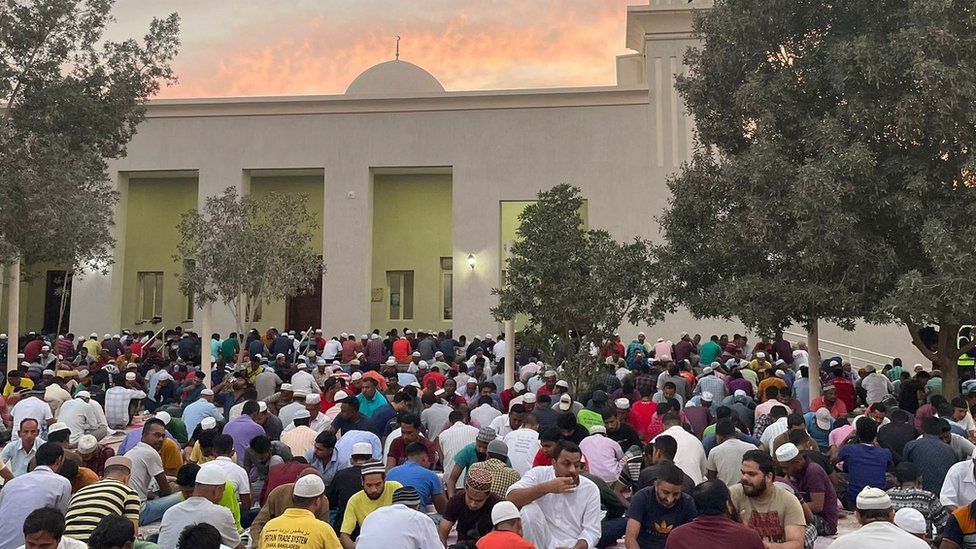 Muslims gather outside a mosque during Ramadan