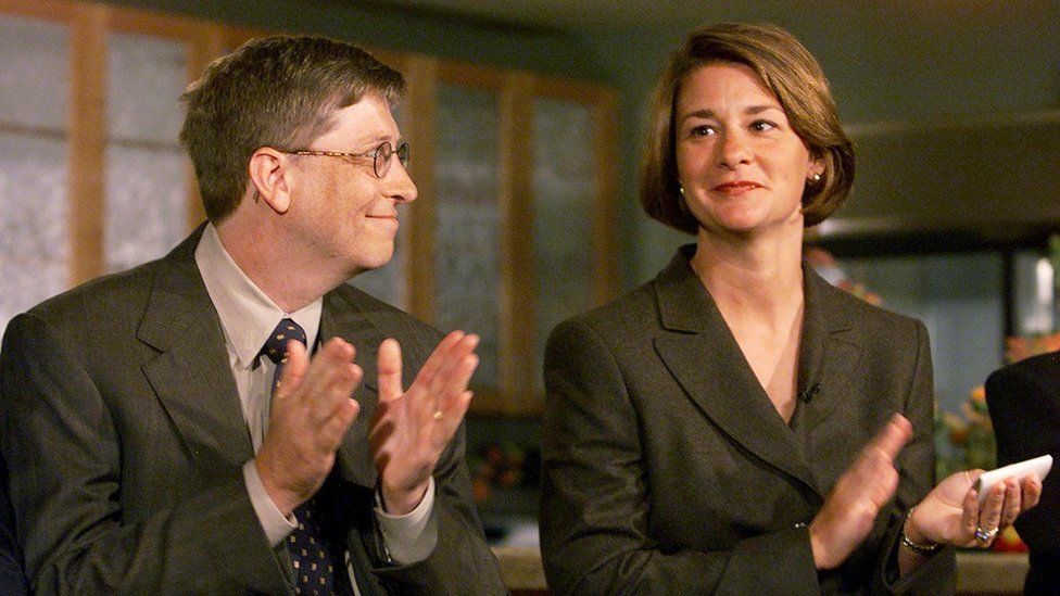 Bill Gates looks at his wife Melinda during a press conference in Seattle in 1999