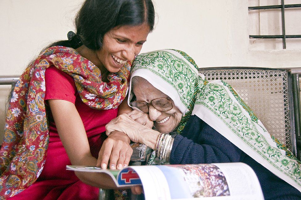 An older lady and her carer in India