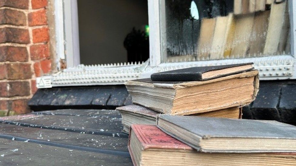 broken window and antic books