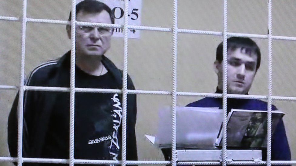 Two of the accused - Vladimir Kalmykov (L) and Ishtimir Khudzhamov