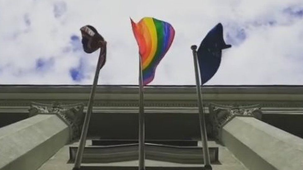 Picture of rainbow flag in front of UK embassy in Minsk