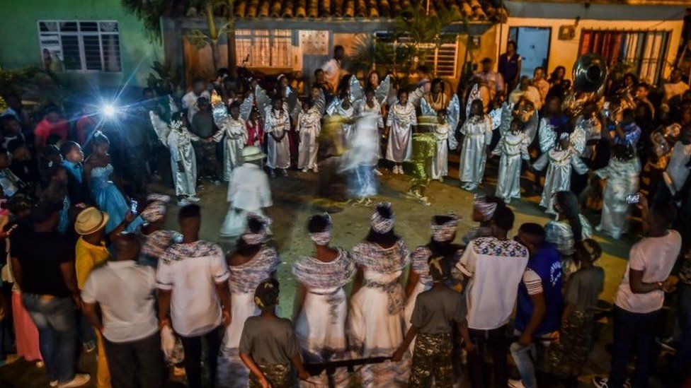 Afro-Colombians dance "Fuga" (Traditional dance) during the "Adoraciones al Nino Dios" celebrations, in Quinamayo, department of Valle del Cauca, Colombia, on February 18, 2018.