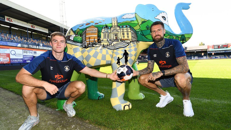 Footballers with an elephant