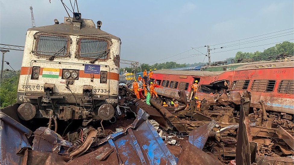 Rescue workers sift through wreckage at the accident site of a three-train collision near Balasore, about 200 km (125 miles) from the state capital Bhubaneswar, on June 3, 2023. A