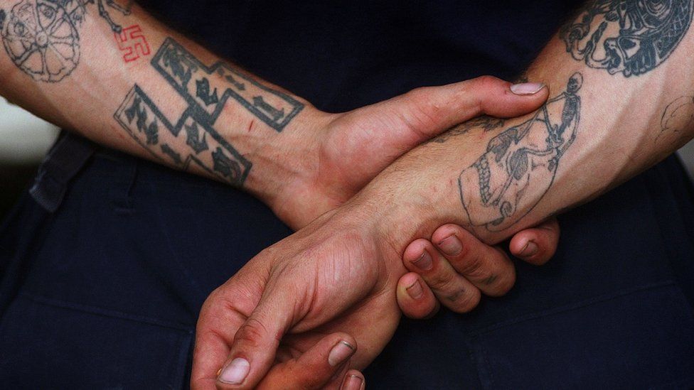 Aryan Nations member with racist tattoos
